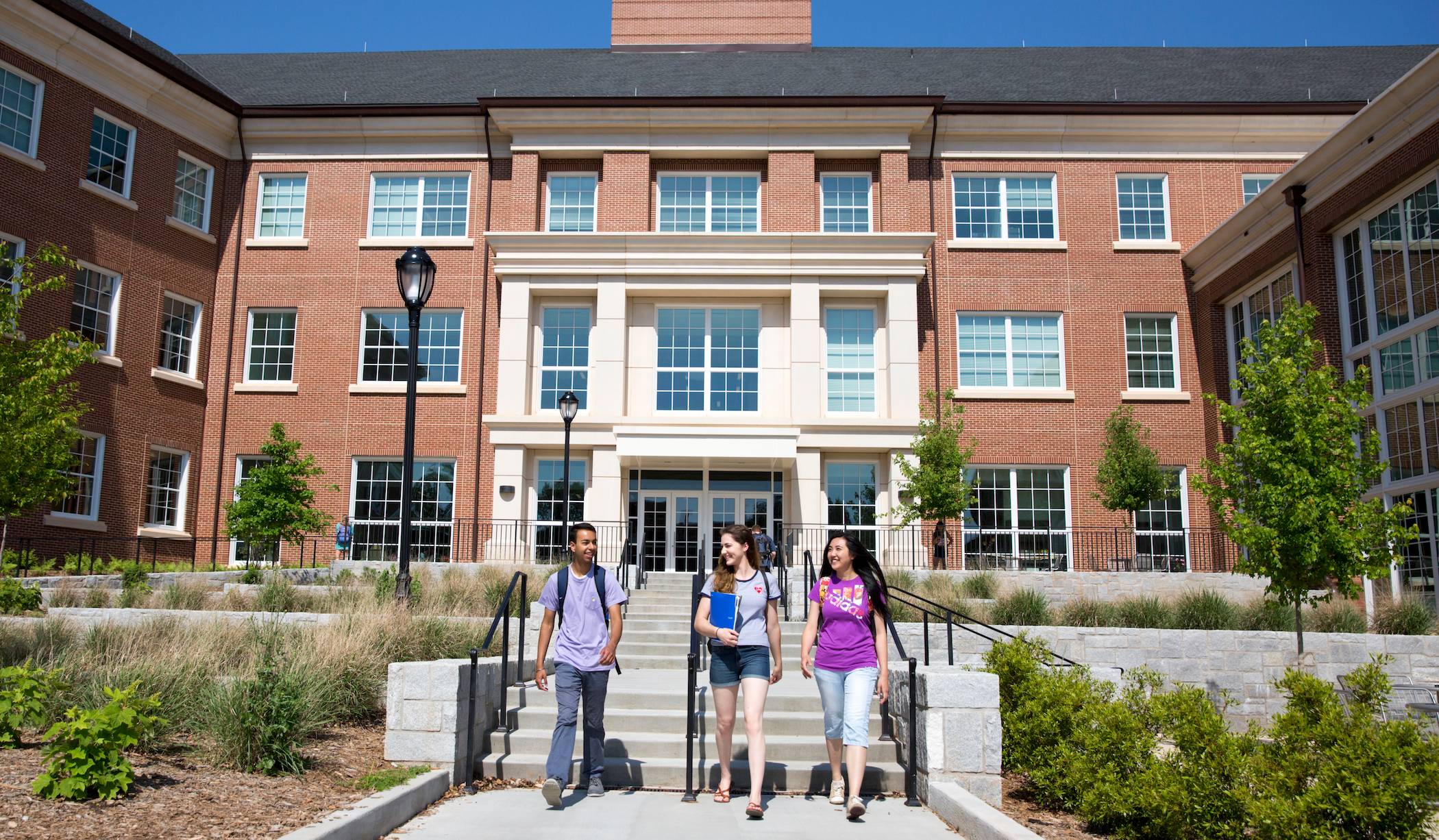 Students walk in front of the Science Learning Center